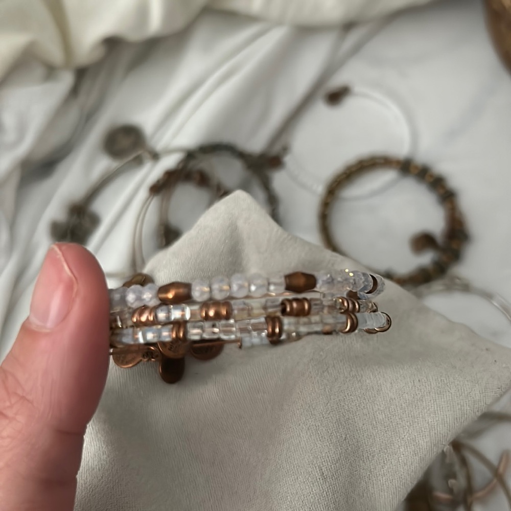 Stack of three rose gold bangles